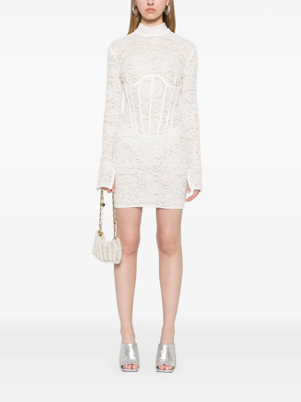 The Isadora Mini Dress in milk white blends delicate lace with a flirty, semi-sheer design. Featuring a stand-up collar, long sleeves, and a corset-style boned bodice, it flatters your figure while adding charm. The concealed rear hook and zip keep the look smooth, and the thigh-length straight hem gives a playful, yet elegant vibe perfect for any occasion.