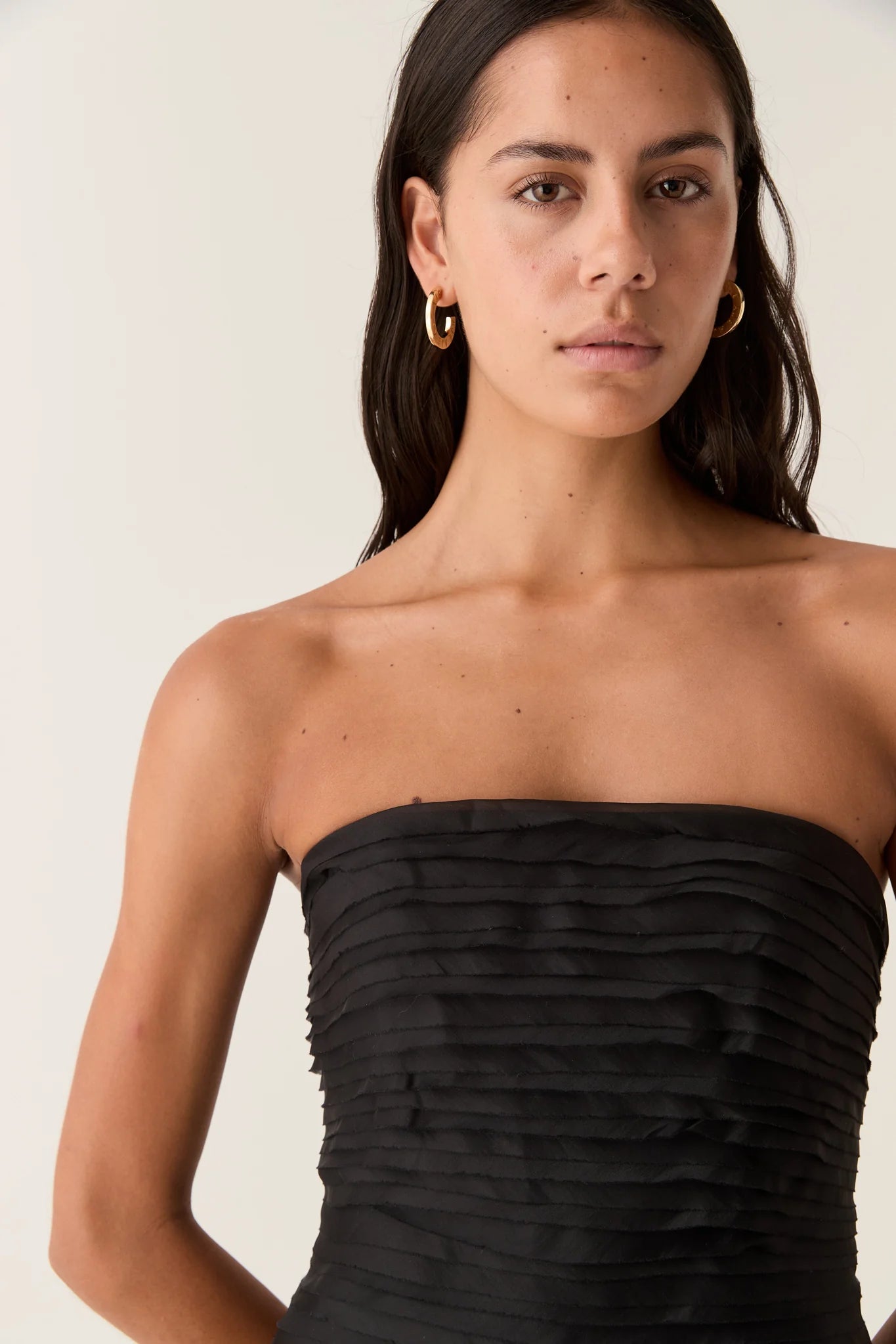 Elevate your style with the Soundscape Maxi Dress by Aje, designed to captivate every gaze. This strapless gown features a fitted bodice with internal boning for a flattering silhouette, paired with delicate raw edge frills adding a touch of effortless charm. The voluminous skirt flows gracefully, perfect for making a statement at any event. Fully lined and secured with a zip, hook, and eye closure, this dress combines comfort with elegance to ensure you look and feel stunning all day or night.