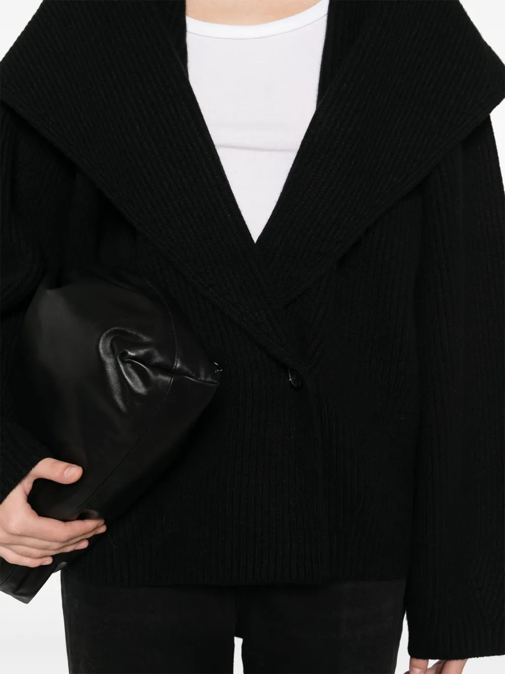 Elevate your wardrobe with this shawl-lapels cardigan from Toteme, a brand renowned for its modern, refined approach to dressing. Designed with a slightly oversized fit and rounded sleeves, it adds sophisticated volume and effortless layering to any outfit. Crafted for comfort and style, this sculptural piece is perfect for defining your personal dress code while staying cozy and polished.