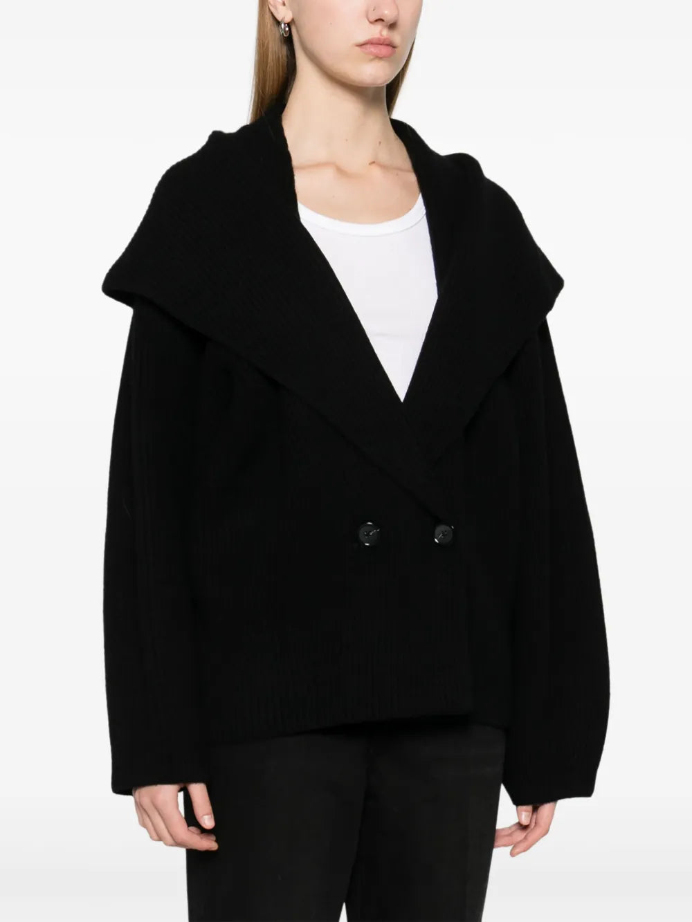 Elevate your wardrobe with this shawl-lapels cardigan from Toteme, a brand renowned for its modern, refined approach to dressing. Designed with a slightly oversized fit and rounded sleeves, it adds sophisticated volume and effortless layering to any outfit. Crafted for comfort and style, this sculptural piece is perfect for defining your personal dress code while staying cozy and polished.