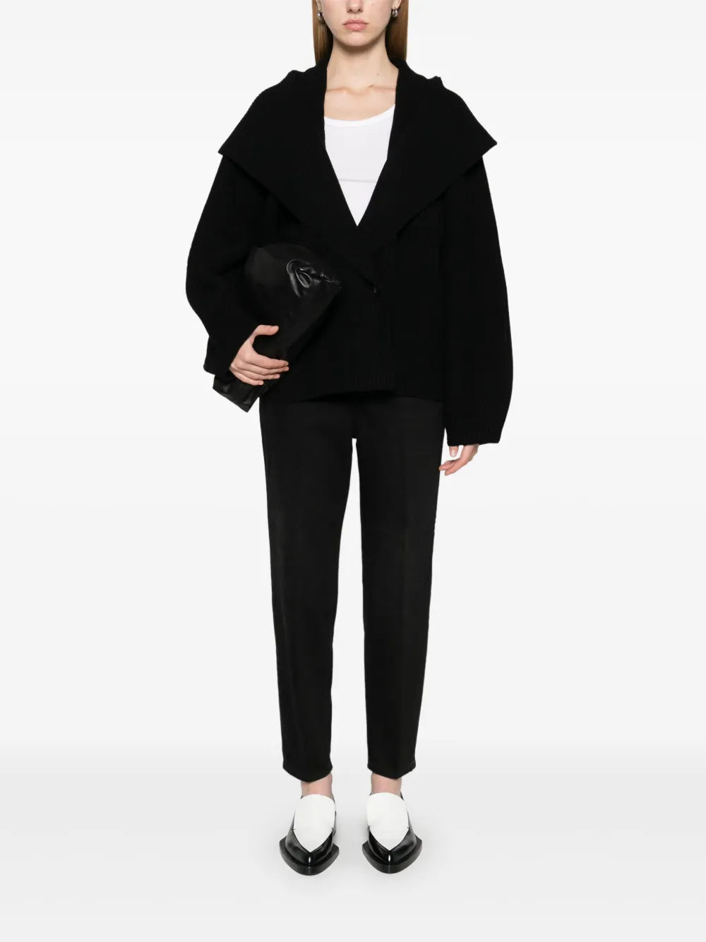 Elevate your wardrobe with this shawl-lapels cardigan from Toteme, a brand renowned for its modern, refined approach to dressing. Designed with a slightly oversized fit and rounded sleeves, it adds sophisticated volume and effortless layering to any outfit. Crafted for comfort and style, this sculptural piece is perfect for defining your personal dress code while staying cozy and polished.