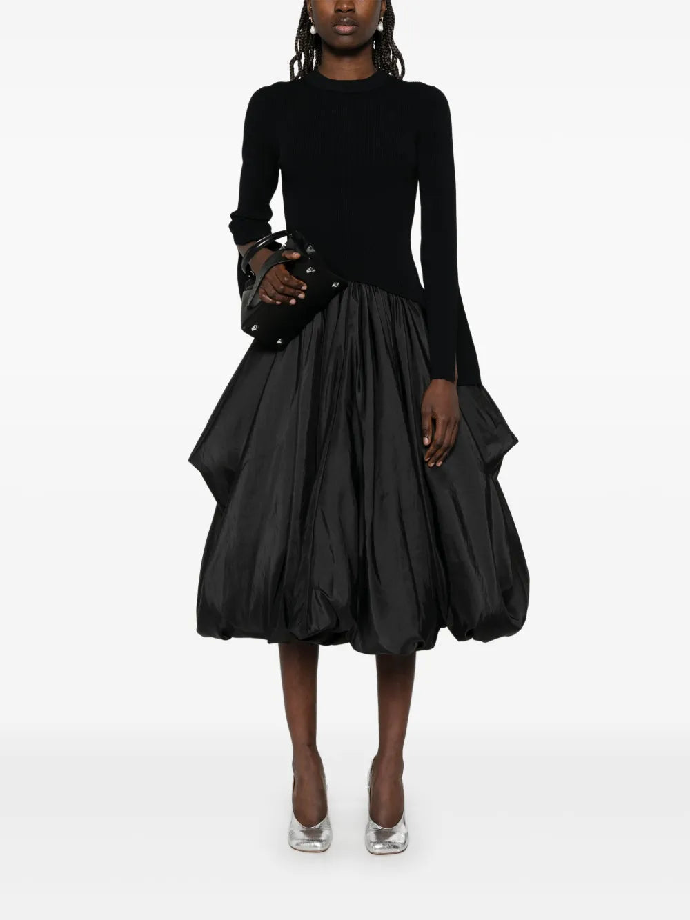 Step into charm with the Kenlie Midi Dress by Simkhai. This black beauty features a playful crew neck and split cuffs that add a flirty twist. The drop waist gives it a flattering silhouette, while the puffball hem dances with every step. Perfect for turning heads, this dress brings a fun and feminine vibe to any occasion.