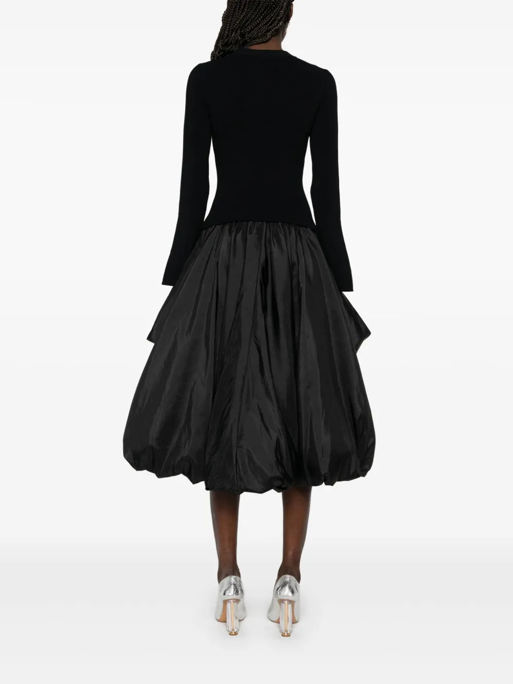 Step into charm with the Kenlie Midi Dress by Simkhai. This black beauty features a playful crew neck and split cuffs that add a flirty twist. The drop waist gives it a flattering silhouette, while the puffball hem dances with every step. Perfect for turning heads, this dress brings a fun and feminine vibe to any occasion.