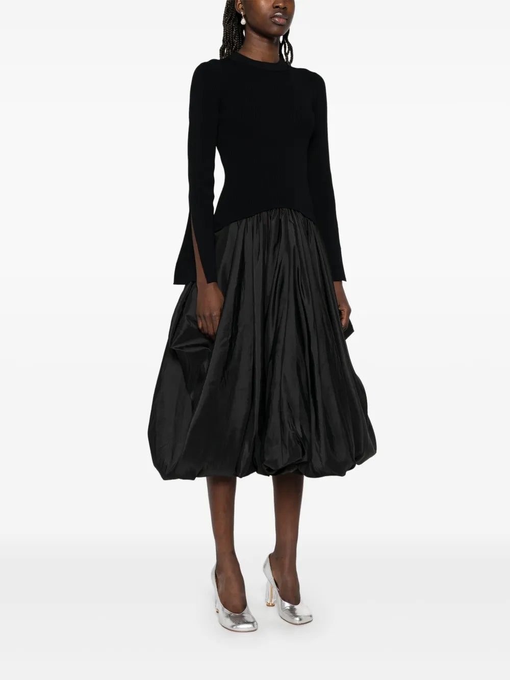 Step into charm with the Kenlie Midi Dress by Simkhai. This black beauty features a playful crew neck and split cuffs that add a flirty twist. The drop waist gives it a flattering silhouette, while the puffball hem dances with every step. Perfect for turning heads, this dress brings a fun and feminine vibe to any occasion.