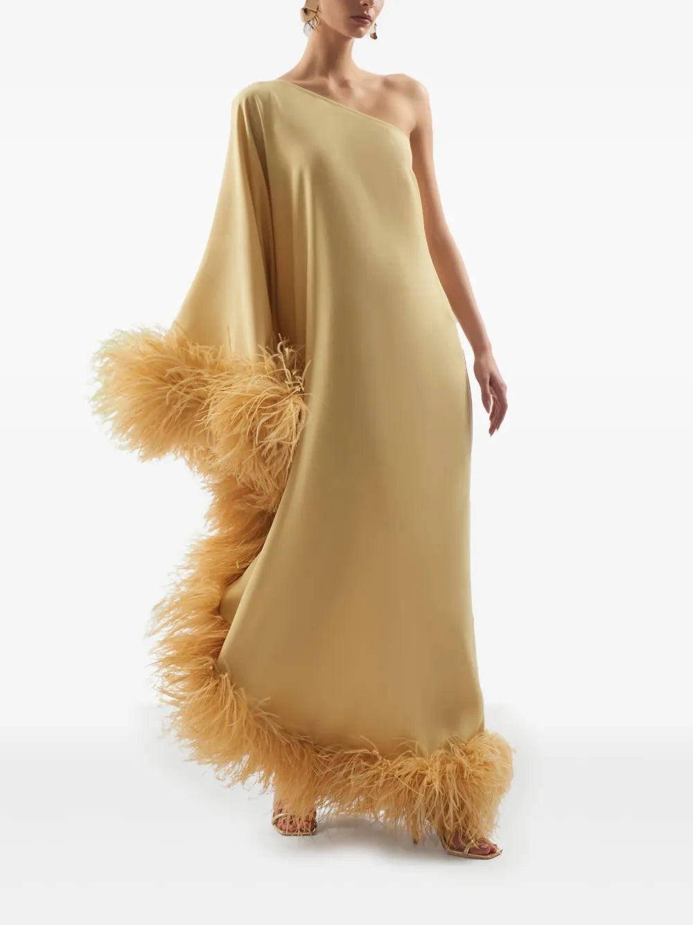 Elevate your style with the Ubud dress by Taller Marmo, crafted in Italy for a touch of refined elegance. This mustard yellow standout features a unique one-shoulder design with a single long sleeve, perfectly complemented by delicate feather detailing. The side zip fastening ensures a flawless fit, making it ideal for special occasions where you want to impress effortlessly.