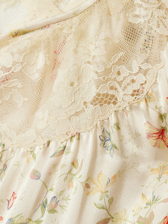 Indulge in the luxurious feel of the DOEN Camri Silk Top. Made from soft silk-satin, this top is adorned with a delicate corded lace trim and a vibrant floral print. Elevate any outfit with this bold and elegant piece. Feel confident and stylish in the Camri Silk Top.