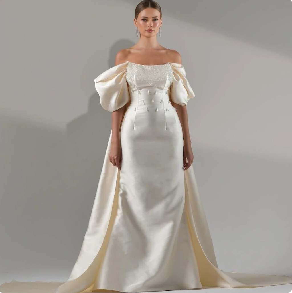 Robe Milagros is perfect for any special occasion. The exquisite off-the-shoulder sheath design features sequin fold detailing, made from luxurious satin fabric for added comfort. Look like a celebrity at your next evening or cocktail event.