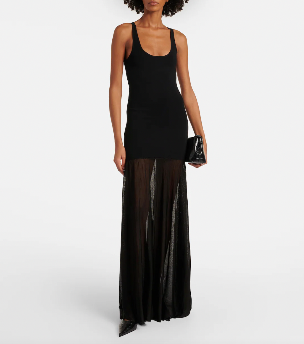 Elevate your evening look with this sleek black maxi dress by Toteme. Featuring a fine knit fabric and a panelled design, it offers both comfort and subtle sophistication. The sleeveless scoop neck and unlined construction keep the silhouette light and breathable, while the flared, long skirt adds graceful movement. Perfect for formal occasions, this dress combines understated elegance with a modern edge.