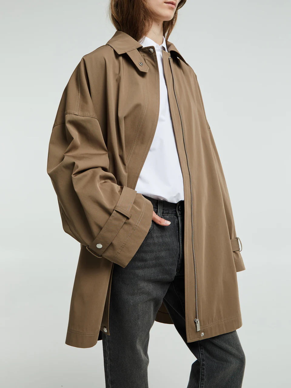 Elevate your everyday wardrobe with this timeless oversized trench jacket by Toteme in a sophisticated hazel tone. Crafted from a breathable cotton blend, it delivers effortless comfort without sacrificing style. The relaxed silhouette provides freedom of movement, making it perfect for layering through seasons. Whether you're dressing up or down, this minimalist essential transitions seamlessly from office to weekend, becoming the versatile piece you'll reach for again and again.