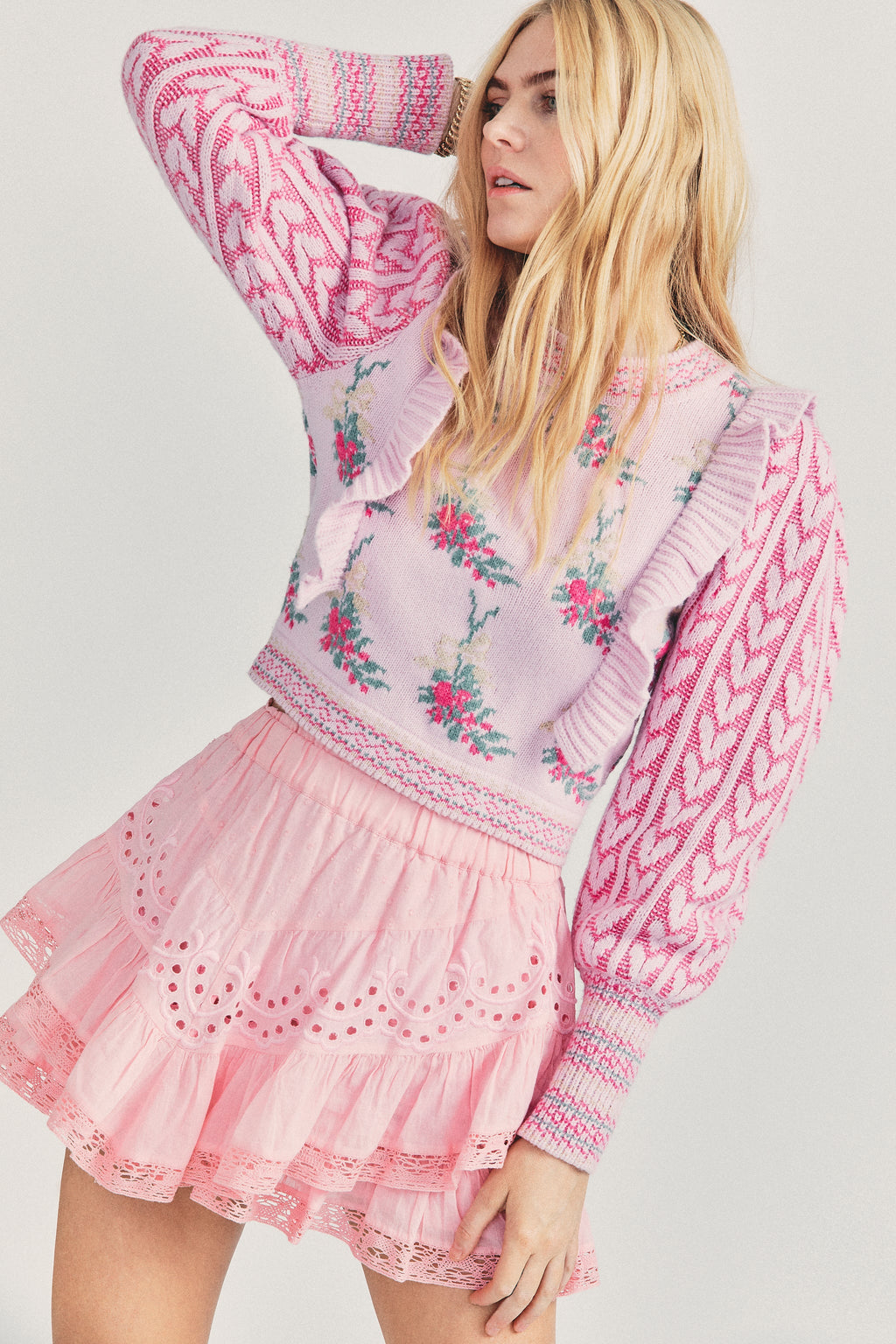 Elevate your style with Warwick in Dew Drop Cream. The romantic floral knit intarsia and framing knit heart jacquard blouson sleeves add a touch of elegance to this cropped crewneck sweater. The striped rib knit neck, cuffs and hem offer a flattering fit and extra detail. Embrace your feminine side with this must-have sweater.