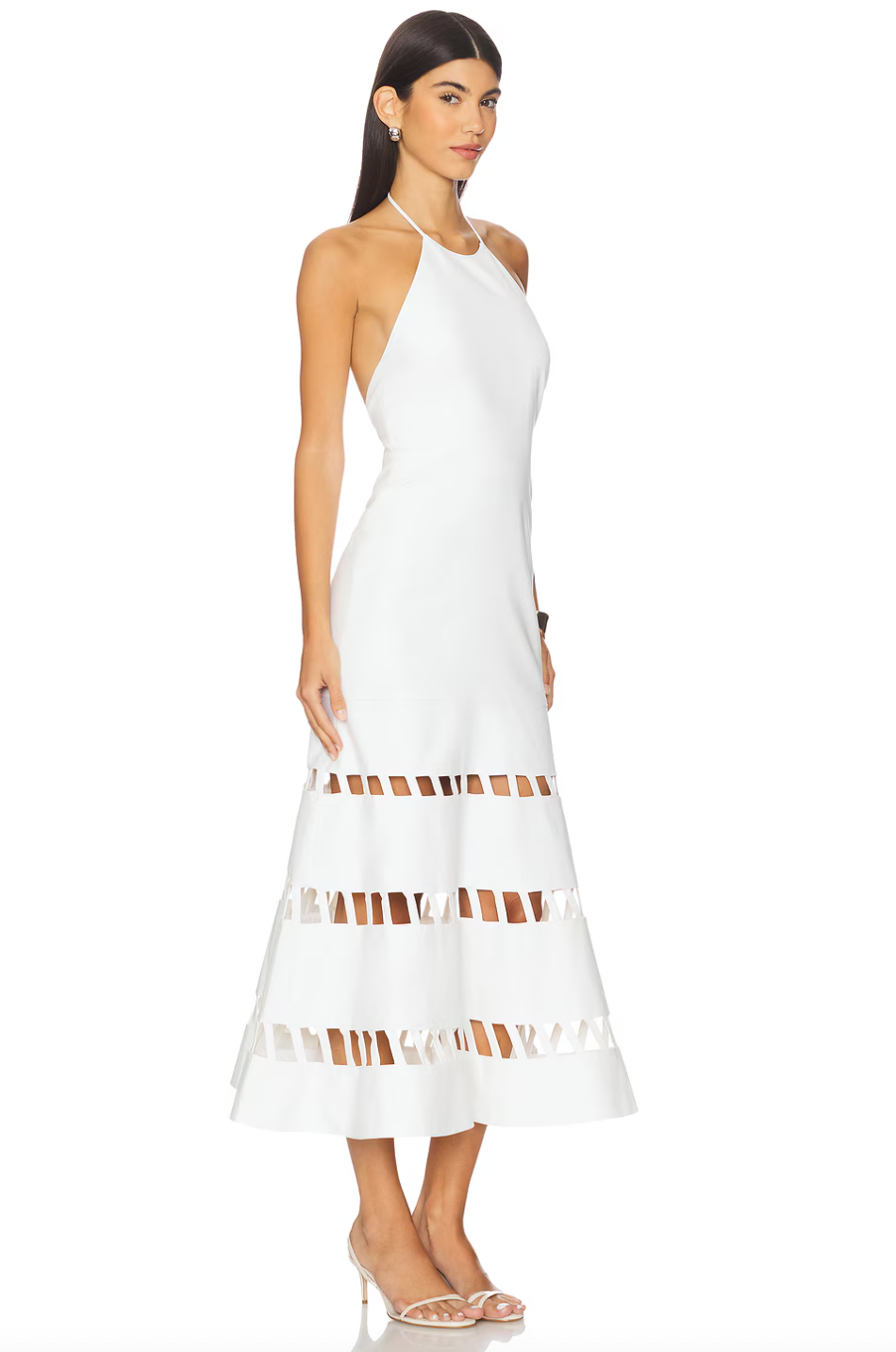 The Janessa Dress by Alexis blends timeless comfort with chic modern design. Crafted from breathable cotton, it keeps you cool and comfortable all day. The elegant halter neckline and midi length offer versatile styling for any warm-weather event. Unique cut-out ladder detailing adds a sophisticated texture, elevating your look effortlessly. Perfect for those seeking a refined yet comfortable dress.