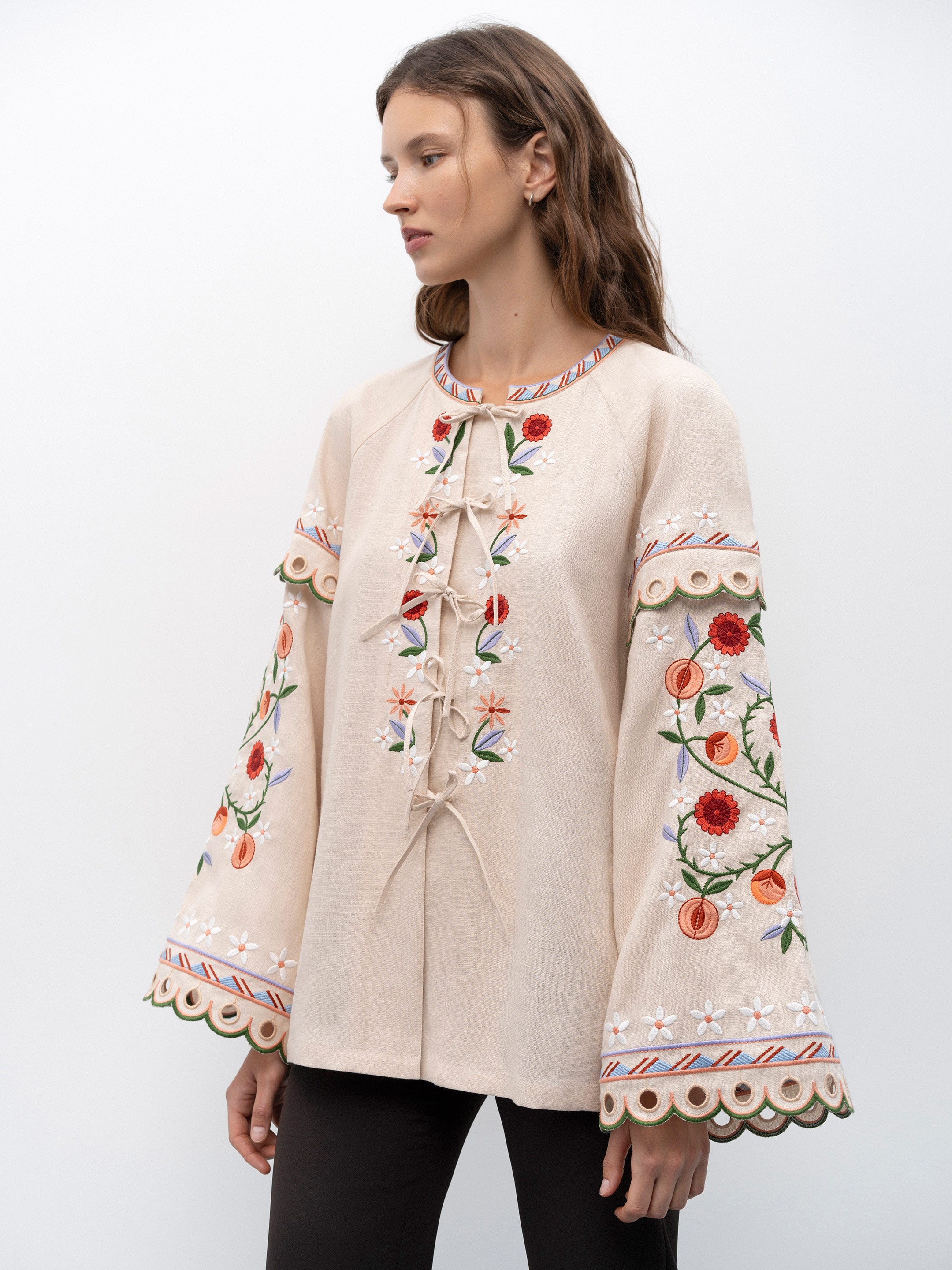 Get ready to turn heads with the Leena Embroidered Blouse! This stylish blouse features a beautiful 3D flower embroidery, flared sleeves, and a chic lace-up neckline. Embrace your unique fashion sense with this vintage-inspired piece.