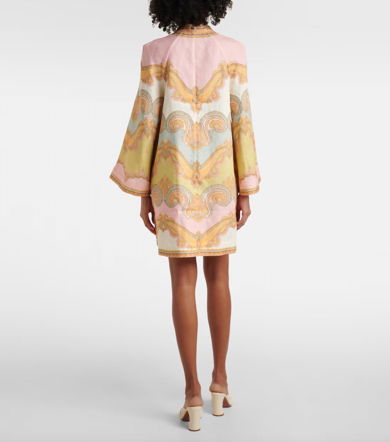 Elevate your resort style with the Maxine paisley linen minidress in Gold Paisley by Zimmermann. Made from breathable linen, this dress combines comfort with elegance, featuring a deep V-neckline and wide sleeves that enhance its chic appeal. Practical patch pockets add convenience, while the center back zip provides a tailored fit. Perfect for relaxed daytime outings or sophisticated evening events, this dress is a versatile addition to your wardrobe.