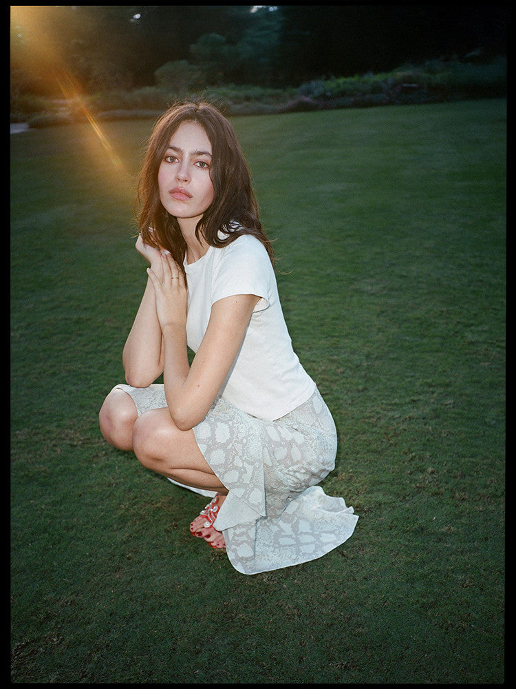 Experience the flirty and feminine charm of The Carmen in Absinthe by Realisation Par. This modern skirt features a flattering silhouette and fluted hemline that adds movement to every step. Perfect for any occasion, pair it with a fitted knit or crisp white tee for a versatile and effortless look. Indulge in classic charm with a touch of modern sophistication.