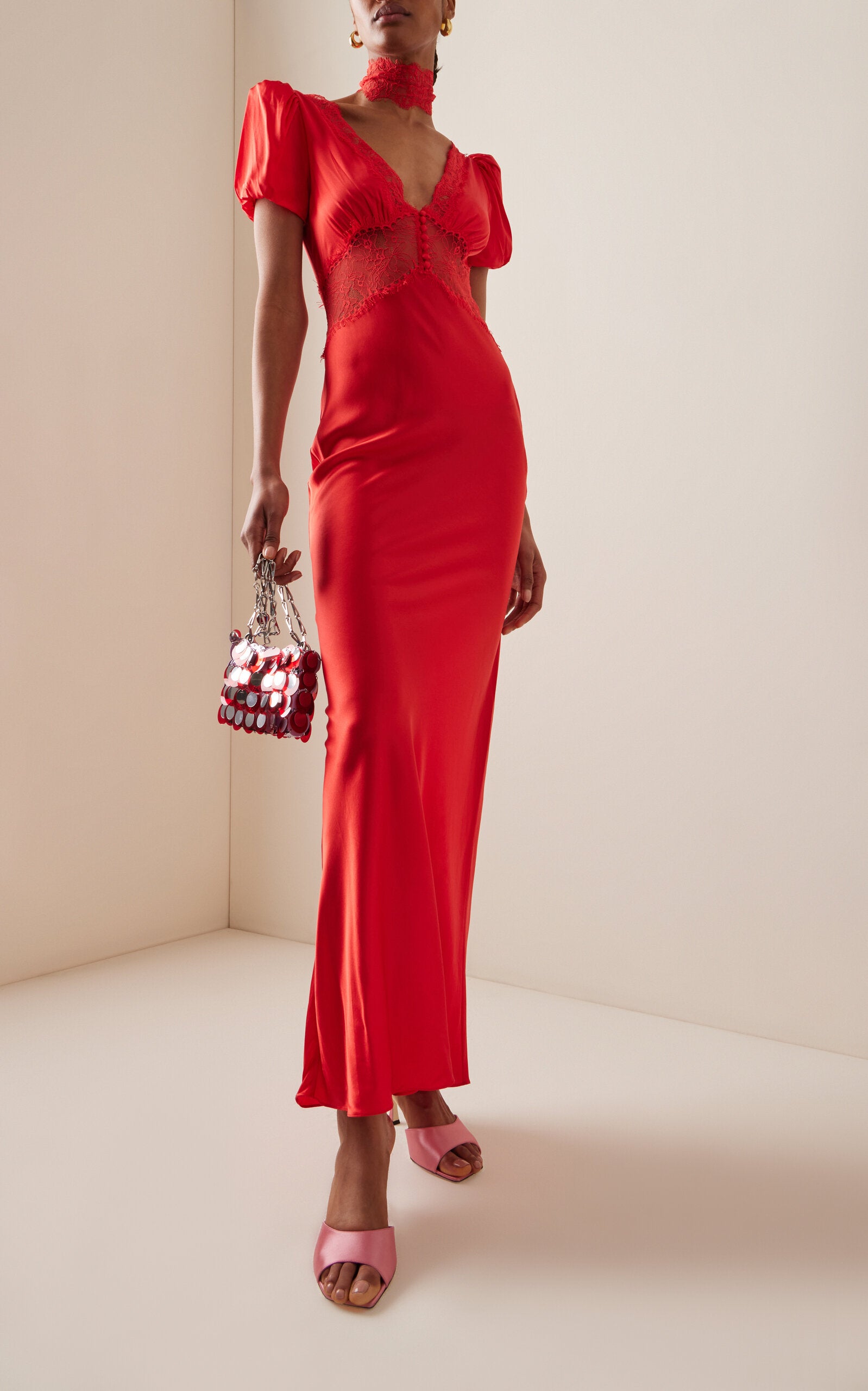 The Pavlova Maxi Dress from De La Vali embodies bold elegance with a bohemian edge. Crafted from a luxurious silk blend, it features delicate lace trimming that elevates its refined design. Its flowing silhouette moves gracefully, offering effortless confidence and making it a standout piece for any occasion. Embrace artistry and sophistication with this captivating maxi dress that honors the spirit of muse Vali Myers.