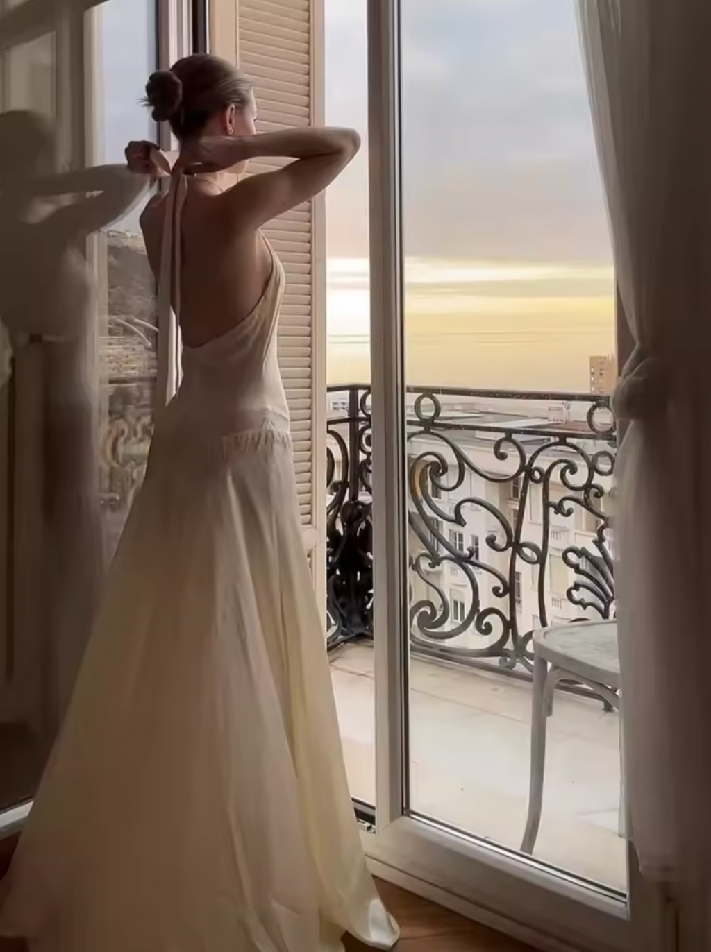 Elevate your evening with the Iridia Satin Maxi Slip Dress, a stunning piece designed to turn heads. This sophisticated gown features a flattering halter neckline and daring backless design that exudes confidence and allure. The delicate lace patchwork detailing adds texture and visual interest, while the strategic lace-up accents enhance your silhouette. The sleek satin fabric drapes beautifully, creating an elegant flow from the fitted bodice to the floor-length hem. 