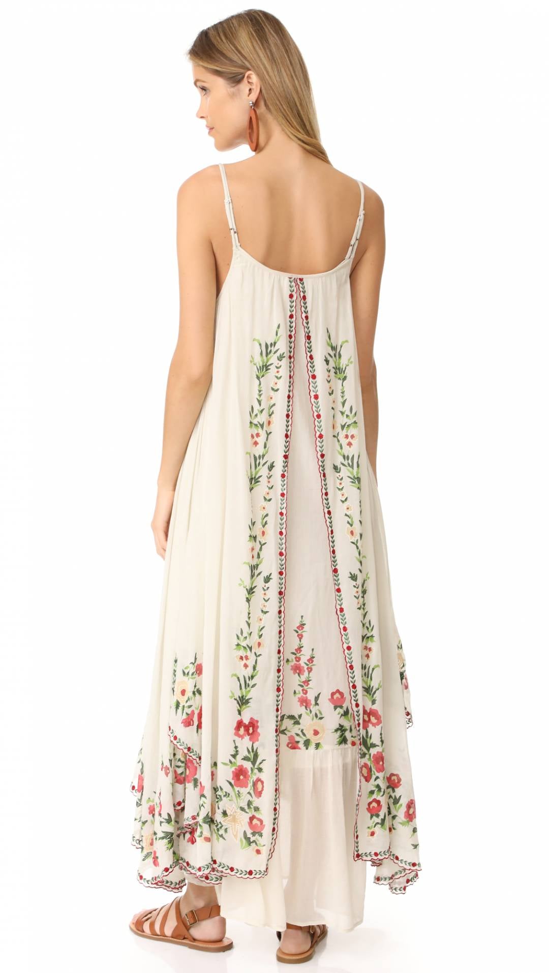 Introducing the Dress Josephine, the perfect summer dress with retro national wind design and delicate flower embroidery. Travel in style with this bohemian beach dress that comes with a halter belt for a flawless fit. Embrace the comfort and elegance of this must-have addition to your wardrobe.