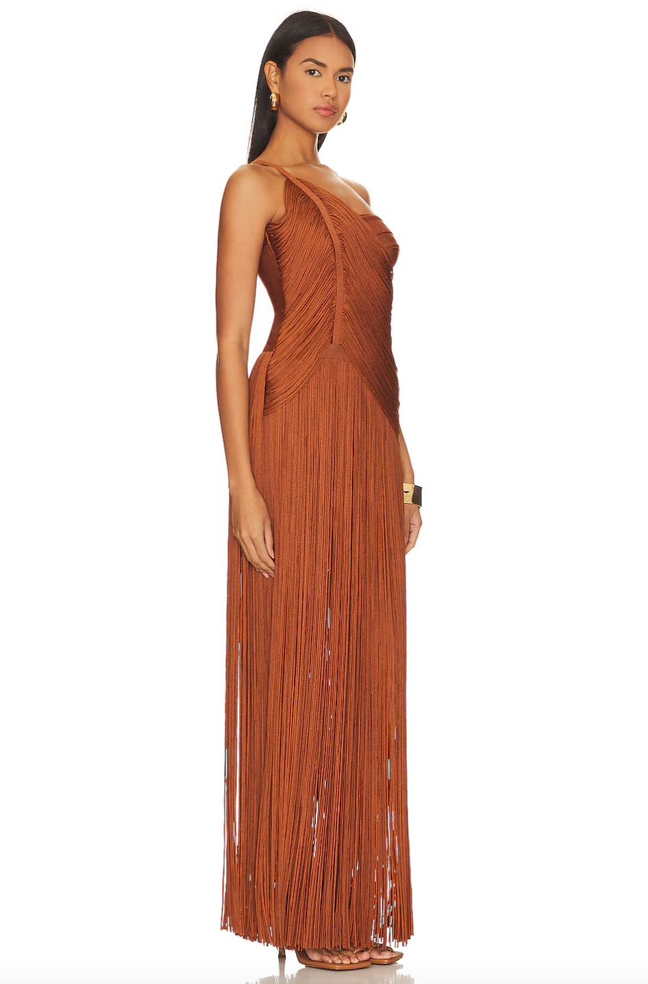 Elevate your style with Hervé Léger's Draped Fringe One Shoulder Gown. The stunning swingy fringe and draped cross-over bodice exude elegance and sophistication, making it perfect for exclusive events. With an asymmetric one-shoulder neck and layered skirt, indulge in luxurious fashion.