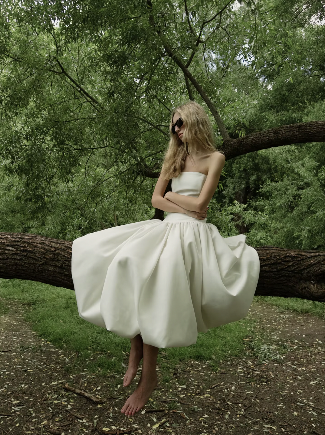 The Mayfair Dress offers timeless sophistication with a modern twist. Featuring a strapless, solid bodice and a flattering A-line silhouette, it highlights your figure with a high waist and pleated skirt that flows elegantly. Perfect for summer events and upscale parties, this sleeveless dress ensures comfort while exuding effortless grace, making it the ideal choice for warm-weather style.