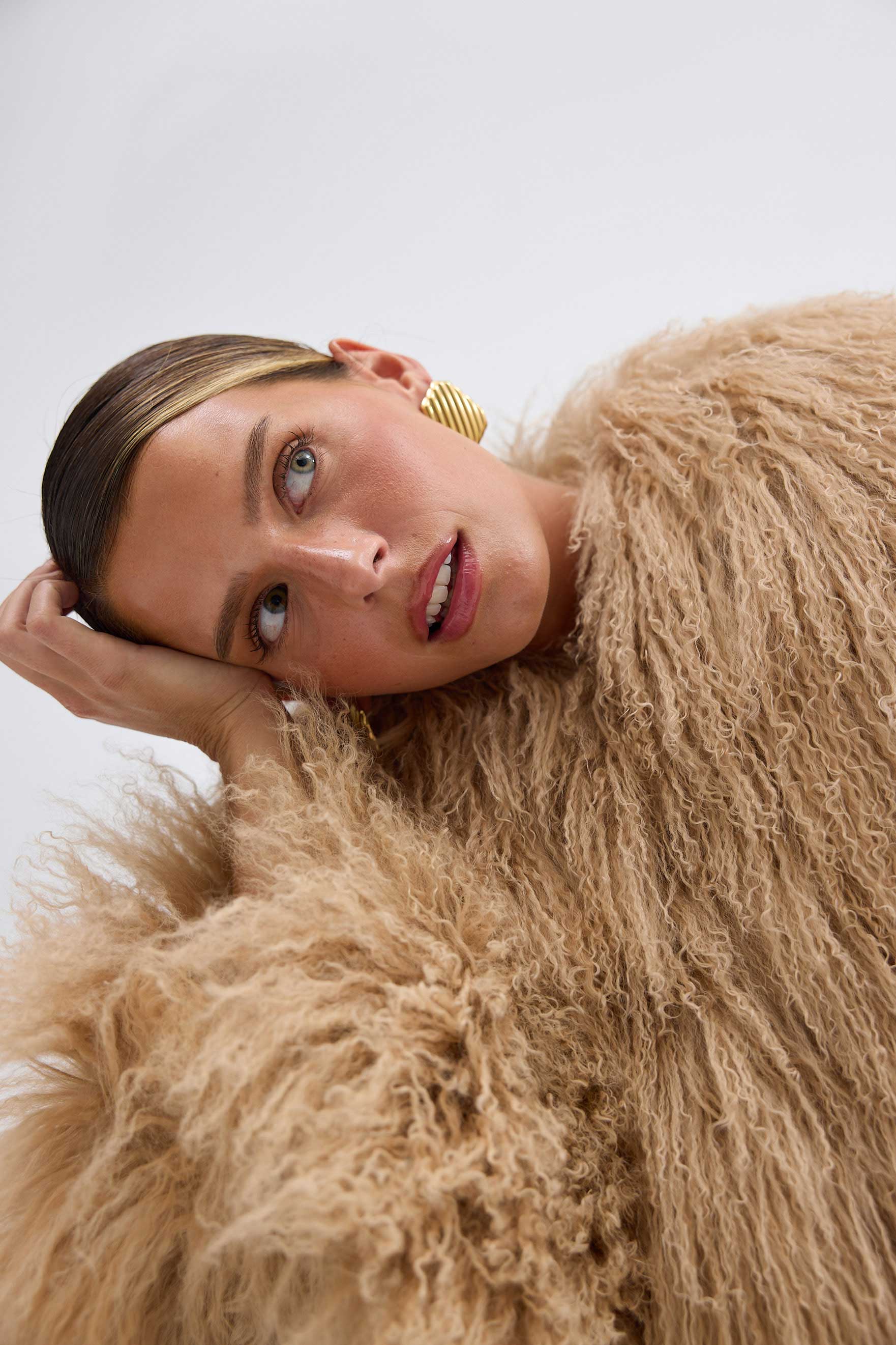 The Georgina Jacket combines timeless style with bold attitude, crafted from 100% luxurious Mongolian lamb fur. Its sleek design features concealed fastenings for a clean, sophisticated look. Perfect for making a statement, this jacket offers both elegance and warmth for any occasion.