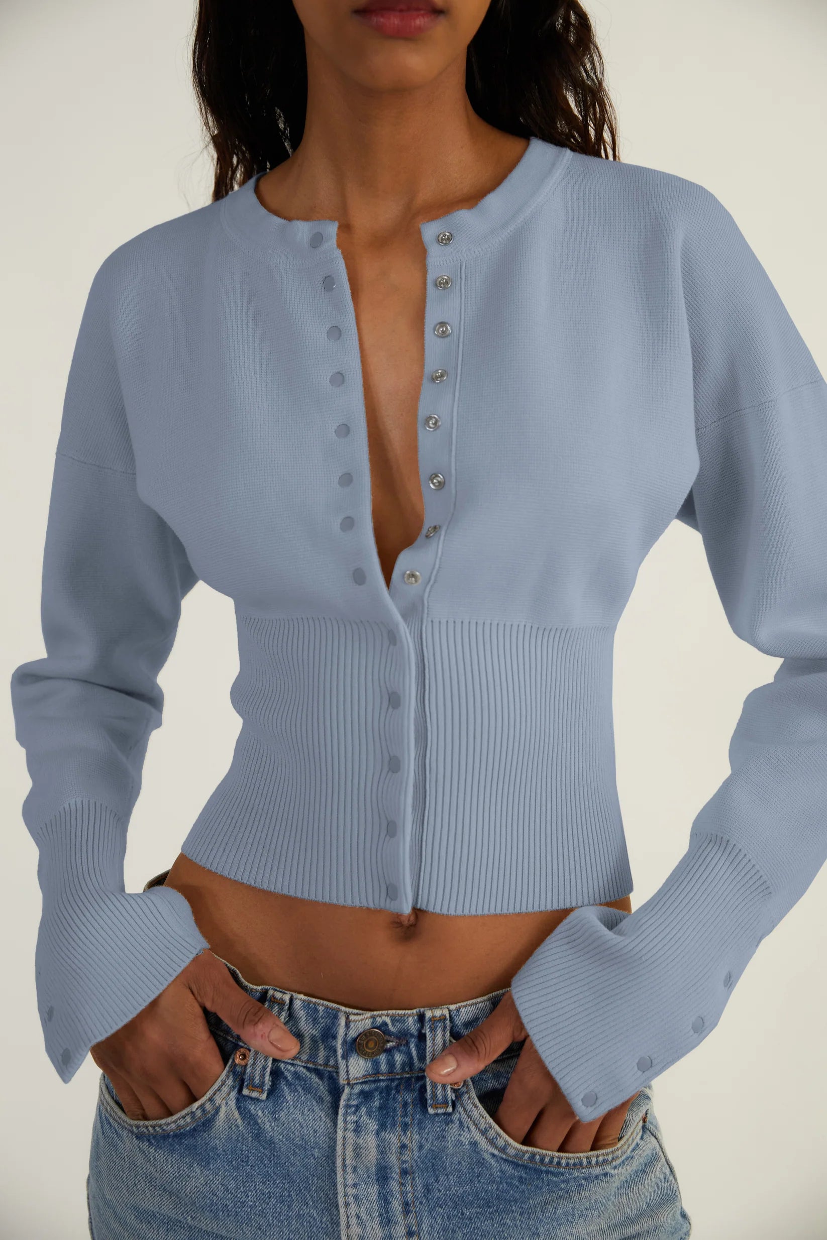 Elevate your style with The Weekend Knit Cardigan by Orseund Iris. Made from a luxurious blend of cotton and silk, this chunky Milano knit cardigan adds volume at the shoulders and cinches at the waist for a flattering silhouette. With its long and dramatic sleeves, it's the perfect addition to your wardrobe for a touch of sophisticated elegance.