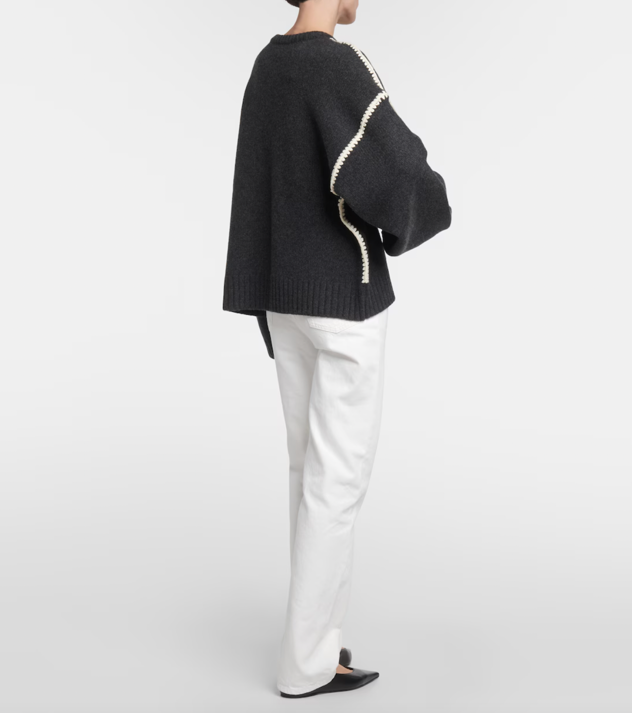 Elevate your wardrobe with this oversized sweater by Toteme crafted from a sumptuous wool and cashmere blend. Its relaxed fit with dropped shoulders offers effortless comfort, while the contrasting cream embroidery adds a refined, distinctive touch. Designed as a timeless staple, it seamlessly enriches your collection, providing both warmth and style for any occasion.