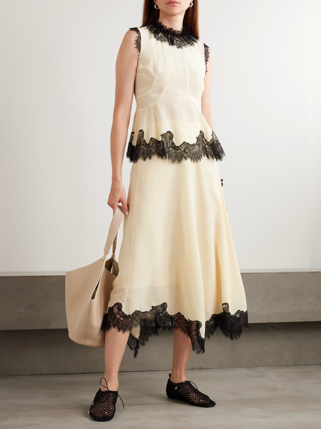 Ulla Johnson’s Rosine Midi Skirt offers timeless elegance with its fluid silk crepe de chine fabric and relaxed A-line silhouette. The delicate contrasting lace trim on the asymmetric hem adds a distinctive vintage flair. Perfectly paired with the matching Bette top, this skirt effortlessly elevates your wardrobe for both casual and special occasions.