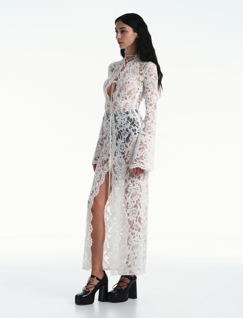 Discover your inner rebel with the Sally lace midi dress! Dare to stand out in this black stunner featuring intricate lace and semi-sheer fabric. Edgy cut-out and lace-up details, along with a front slit and straight hem, take your style to the next level. Are you ready for the adventure? This dress has got you covered!