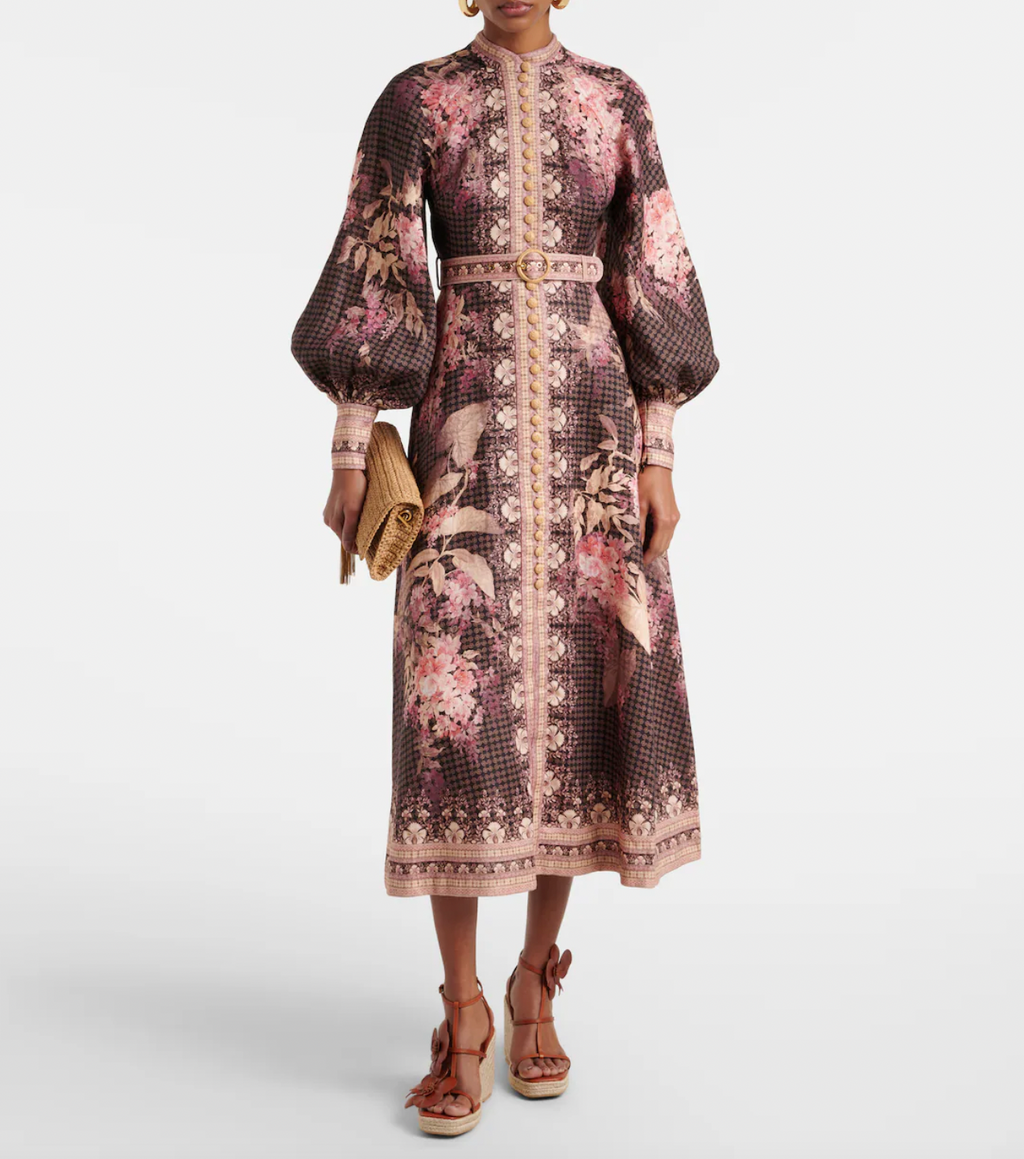 Discover effortless elegance with Zimmermann's Illuminate midi dress, crafted from breathable linen and adorned with a delicate floral print. The voluminous blouson sleeves add romantic movement, while natural raffia buttons and a coordinating belt create a polished silhouette. Perfect for warm-weather occasions, this dress combines timeless style with comfortable sophistication.