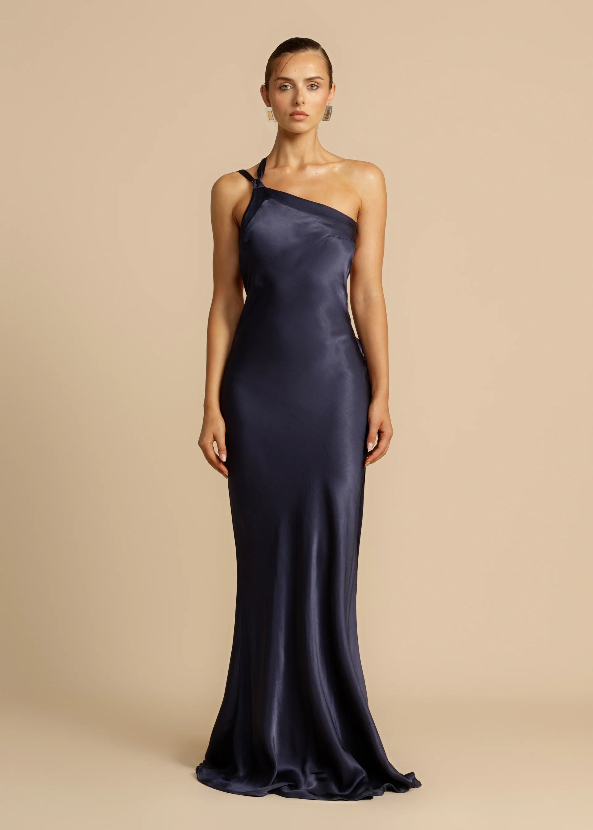 Unleash your inner diva with Monique, a stunning floor-length gown that exudes modern elegance. Crafted from luxurious viscose to enhance your curves, Monique's one-shoulder design, open back, and crossover detailing exude sophistication. Whether it's a starlit night or a glamorous event, Monique is the perfect choice for making a lasting impression.