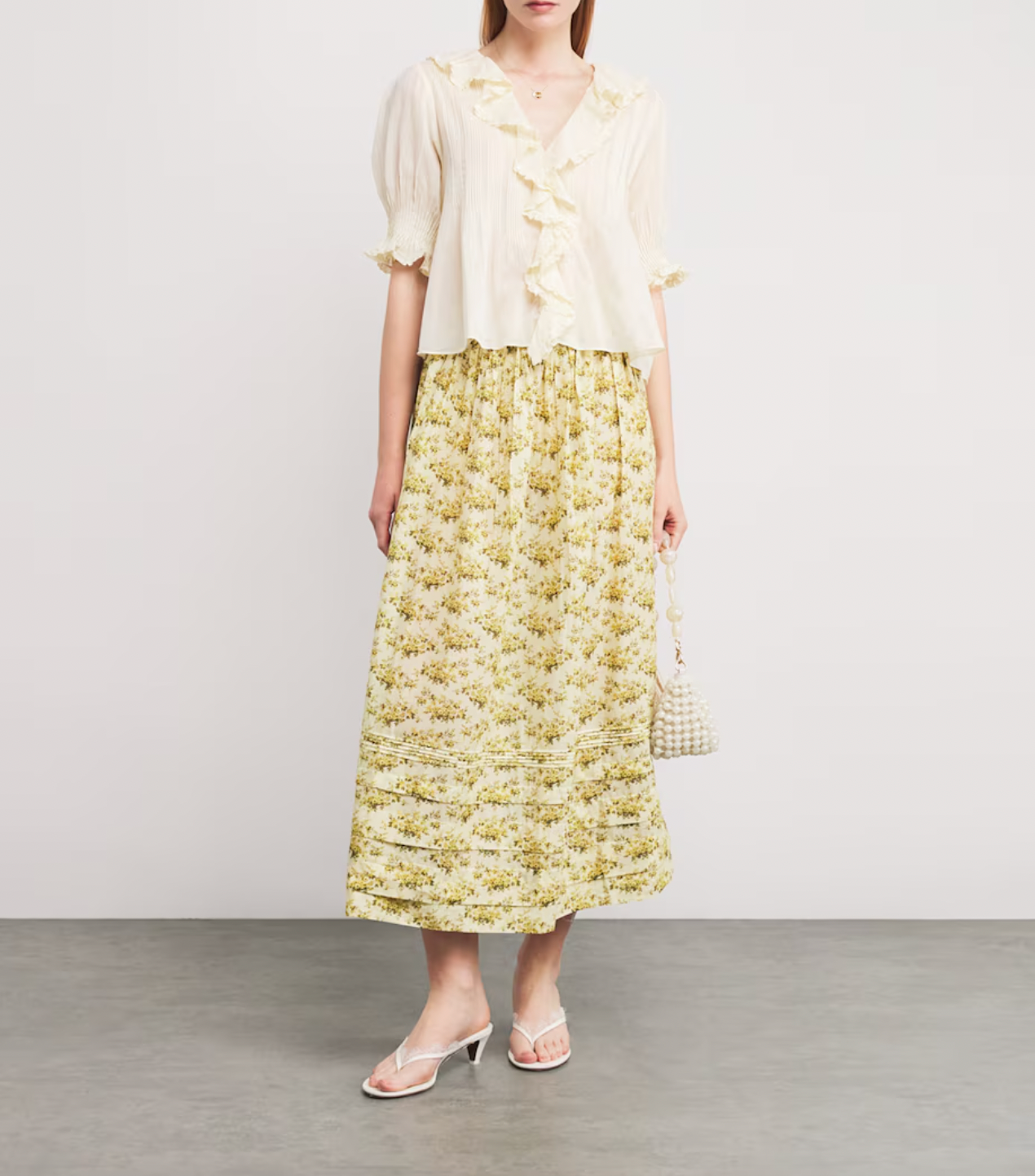The Marcie Midi Skirt by DÔEN combines timeless romance with everyday ease. Its featherlight fabric and Victorian-inspired floral print bring a delicate, vintage charm, while subtle pintuck details enhance its graceful silhouette. Designed to move effortlessly through your day, this skirt is a versatile staple that elevates your wardrobe with minimal effort. Perfect for the woman seeking style that complements a busy lifestyle without sacrificing elegance.
