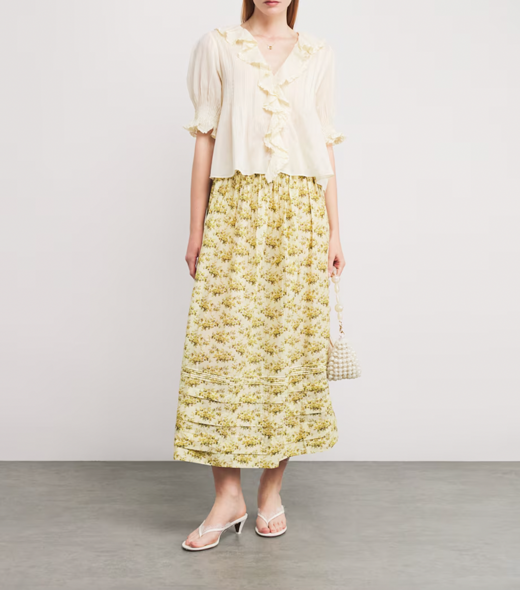 The Marcie Midi Skirt by DÔEN combines timeless romance with everyday ease. Its featherlight fabric and Victorian-inspired floral print bring a delicate, vintage charm, while subtle pintuck details enhance its graceful silhouette. Designed to move effortlessly through your day, this skirt is a versatile staple that elevates your wardrobe with minimal effort. Perfect for the woman seeking style that complements a busy lifestyle without sacrificing elegance.