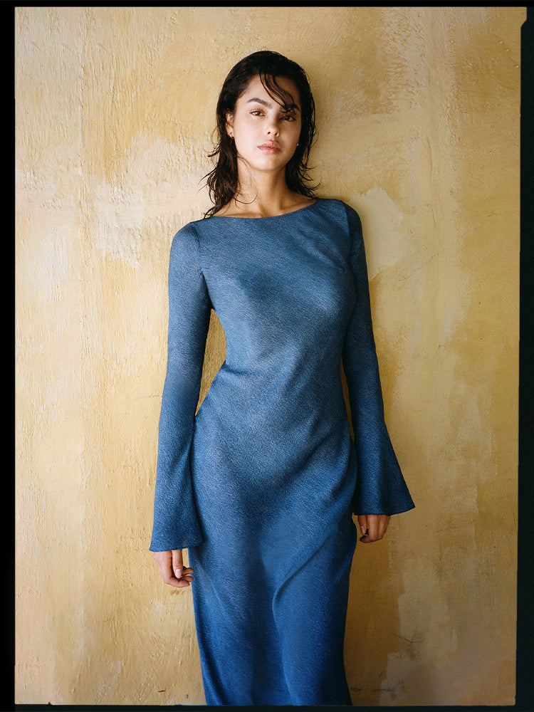 Indulge in the ultimate refined 70's elegance with The Gia in Denim. This stunning dress features bell sleeves and a floor length hem, perfect for an intoxicating night in Marrakech. For all our glamazon Dreamgirls, the Gia is the must-have dress that will make you feel like a true goddess.