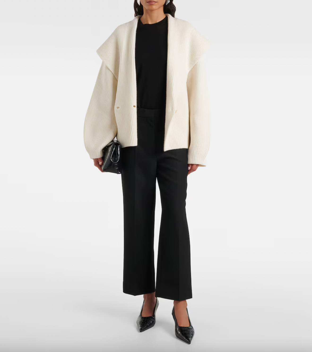 Elevate your wardrobe with this shawl-lapels cardigan from Toteme, a brand renowned for its modern, refined approach to dressing. Designed with a slightly oversized fit and rounded sleeves, it adds sophisticated volume and effortless layering to any outfit. Crafted for comfort and style, this sculptural piece is perfect for defining your personal dress code while staying cozy and polished.