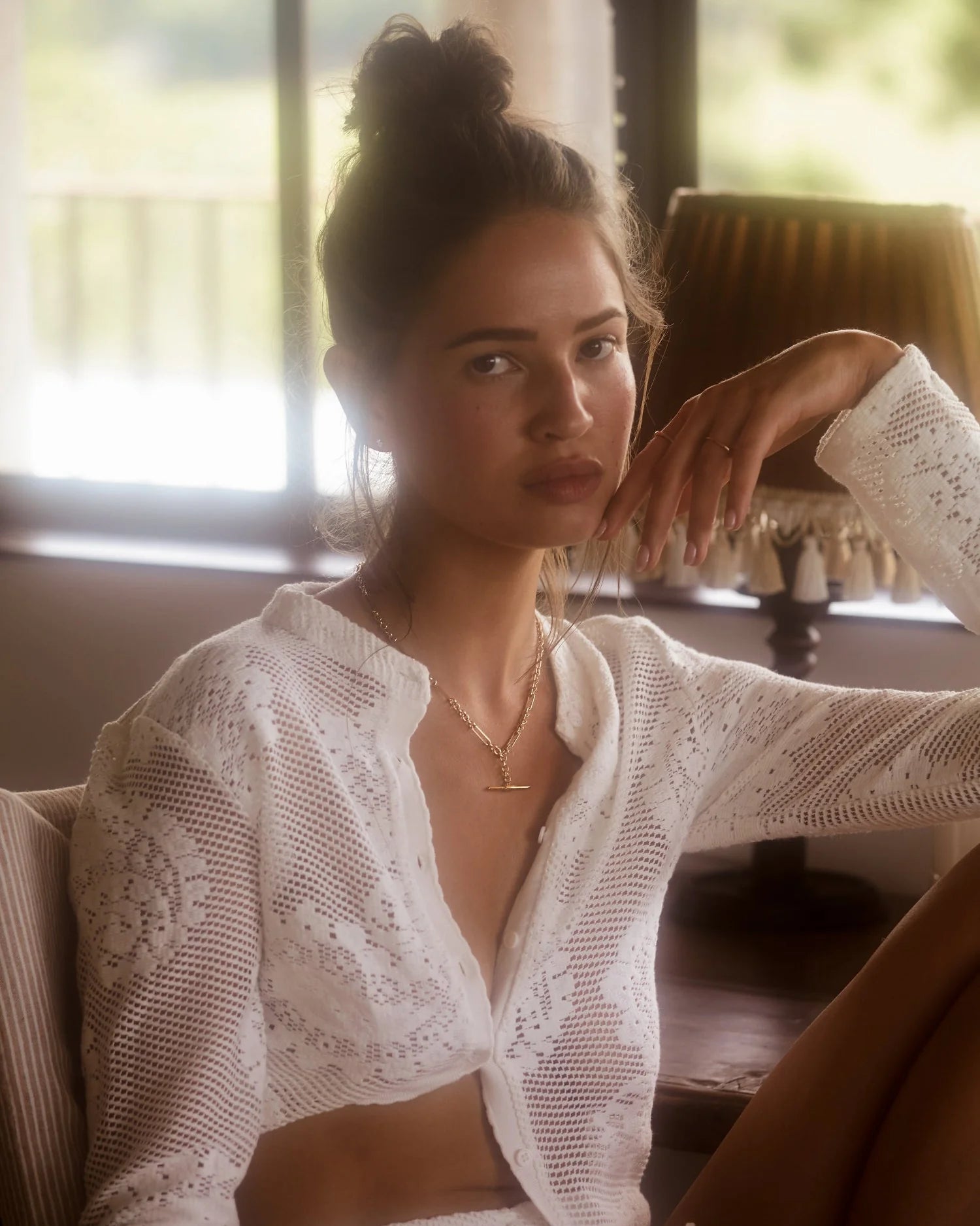 Elevate your wardrobe with the Dom Cardigan, a refined long-sleeve piece crafted for effortless elegance. Featuring a button-up front and a sleek neckline collar, its delicate scalloped trim and custom hand-drawn crochet lace detail add a touch of sophistication. Perfect for layering, this cardigan blends classic design with artisanal craftsmanship to enhance any outfit with subtle grace.