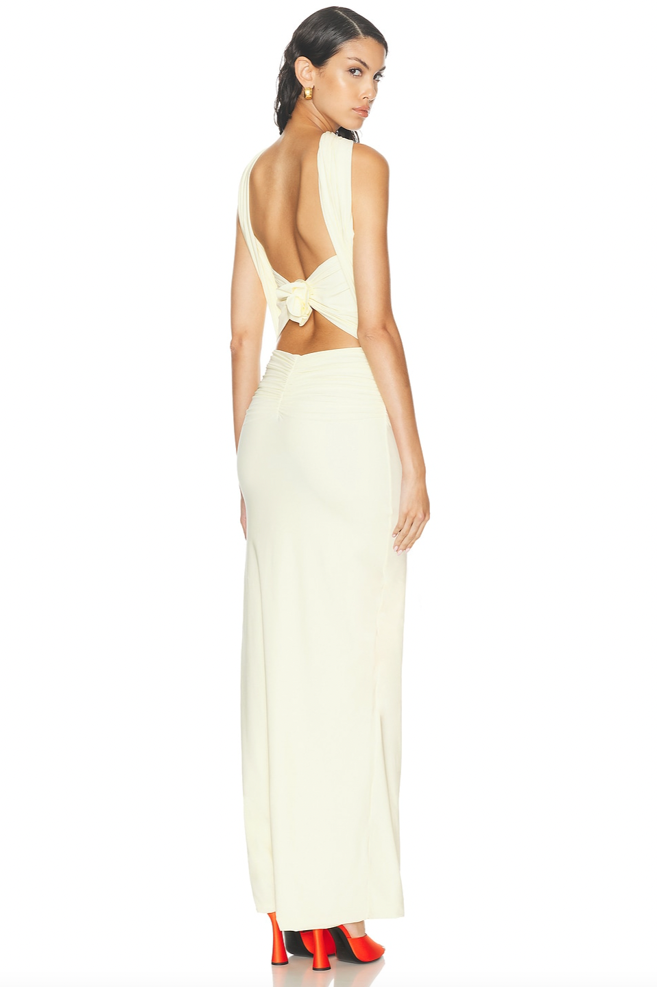 Discover the Maygel Coronel Mullett Dress—a captivating pale yellow maxi that commands attention with its sleek, body-skimming silhouette and daring knotted open back. Crafted from luxuriously smooth fabric, this piece exudes understated elegance while making a bold statement. Whether you're attending a summer soirée or an upscale cocktail gathering, this versatile dress transitions effortlessly from evening glamour to refined daytime sophistication. 
