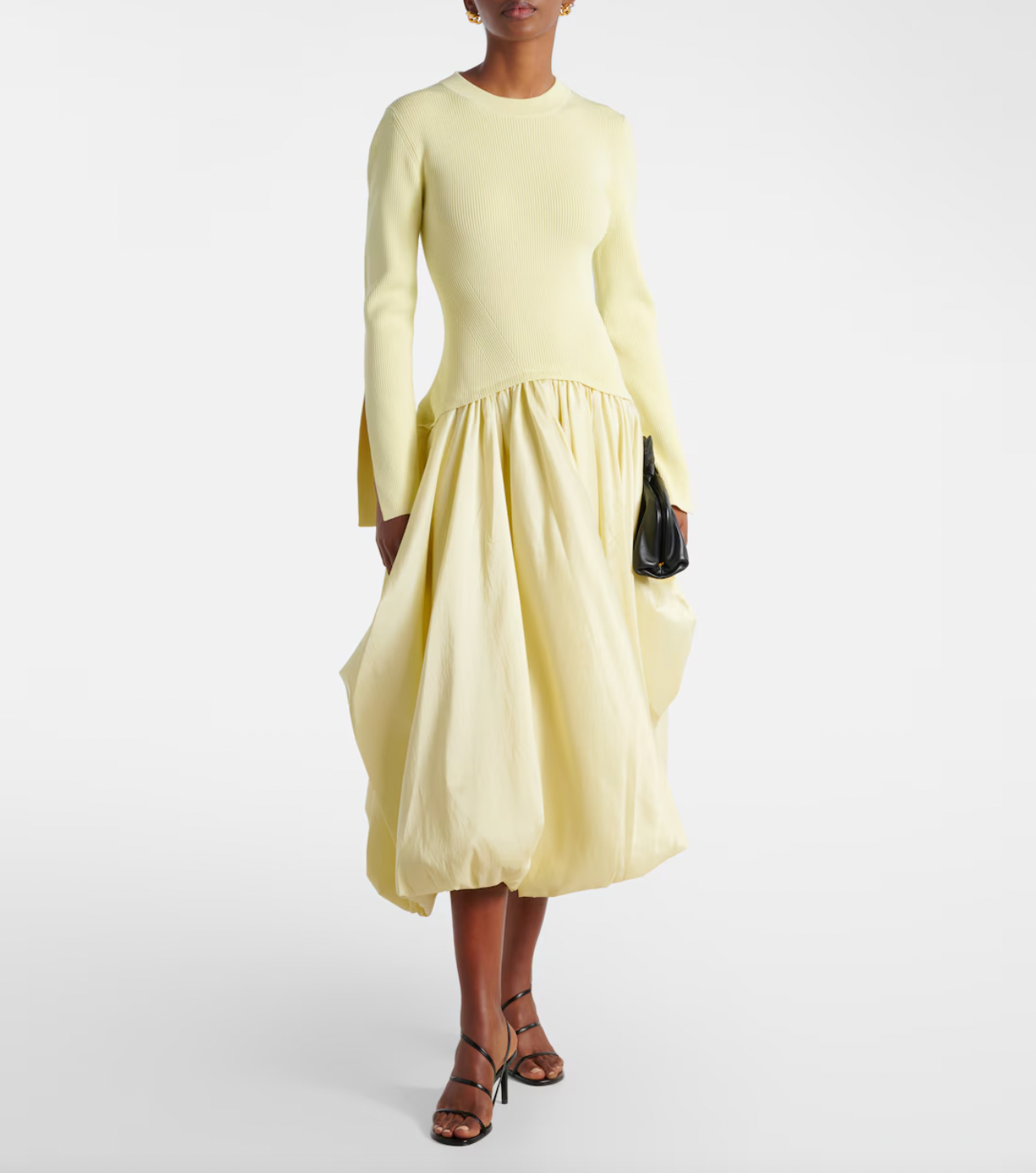 The Izzy Taffeta Midi Dress from Simkhai offers a striking blend of textures, featuring a ribbed-knit bodice that flatters your shape and a voluminous taffeta skirt that commands attention. This unique silhouette ensures you stand out effortlessly at any event, combining comfort with bold elegance for a memorable style statement.