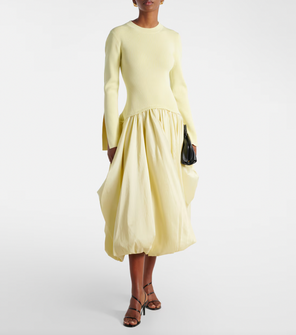 The Izzy Taffeta Midi Dress from Simkhai offers a striking blend of textures, featuring a ribbed-knit bodice that flatters your shape and a voluminous taffeta skirt that commands attention. This unique silhouette ensures you stand out effortlessly at any event, combining comfort with bold elegance for a memorable style statement.