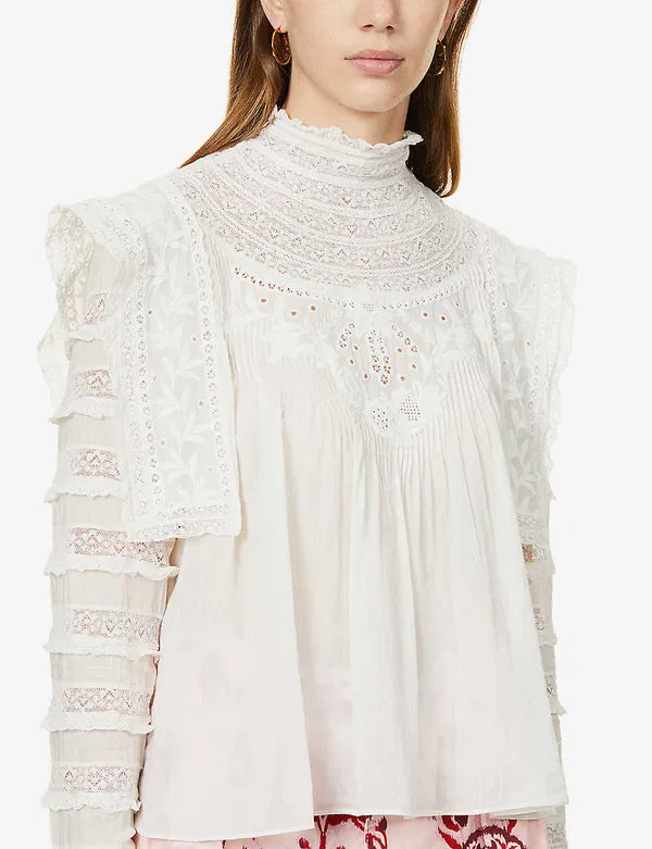 Upgrade your wardrobe with your new favorite top - the Giulia Ruffled Embroidered Cotton-Blend Blouse! Crafted from a luxurious cotton and silk blend, this blouse features delicate broderie anglaise details at the neckline and charming ruffle trim. Each wear will bring a touch of whimsy and romance to your day.