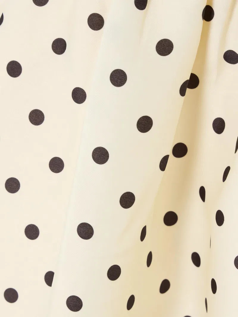 Embrace timeless elegance with this Polka-dot taffeta midi dress inspired by classic 1950s fashion. The luxurious taffeta fabric shines subtly, while the structured bodice and gathered waist beautifully highlight a full, flattering skirt. Perfect for making a graceful statement, pair it with point-toe pumps to complete your vintage-chic look.