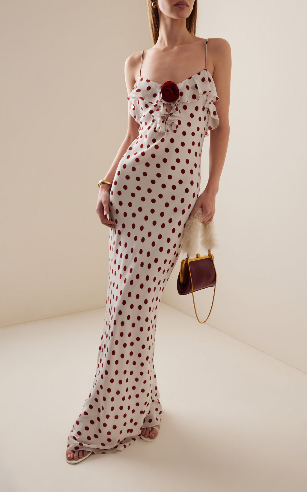 Step into timeless elegance with the Esperanza Dress by De La Vali, crafted from flowing polka-dot crepe de chine. This maxi dress combines lightweight comfort with a flattering silhouette, making it perfect for both day and evening occasions. Its classic print and graceful movement ensure you stand out with sophisticated charm wherever you go.