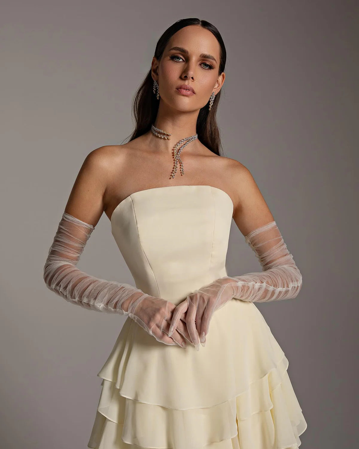 The Alexandra Gown is an elegant and sophisticated evening dress, perfect for formal occasions and weddings. Its flattering mermaid silhouette, flowing cut, and long sleeves create a sophisticated look. The unique criss-cross design adds a modern twist to this traditional Arabic design. Make a statement with this stunning piece!