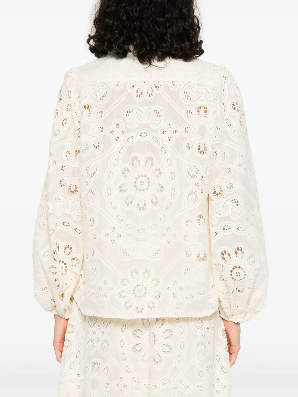 Elevate your wardrobe with this Zimmermann floral-embroidered shirt. In a versatile beige tone, it features delicate cut-out floral detailing that adds a touch of femininity and sophistication. The front button fastening ensures easy wear, while long sleeves with elasticated cuffs provide comfort and style. Perfect for any occasion, this shirt effortlessly combines elegance with everyday ease.
