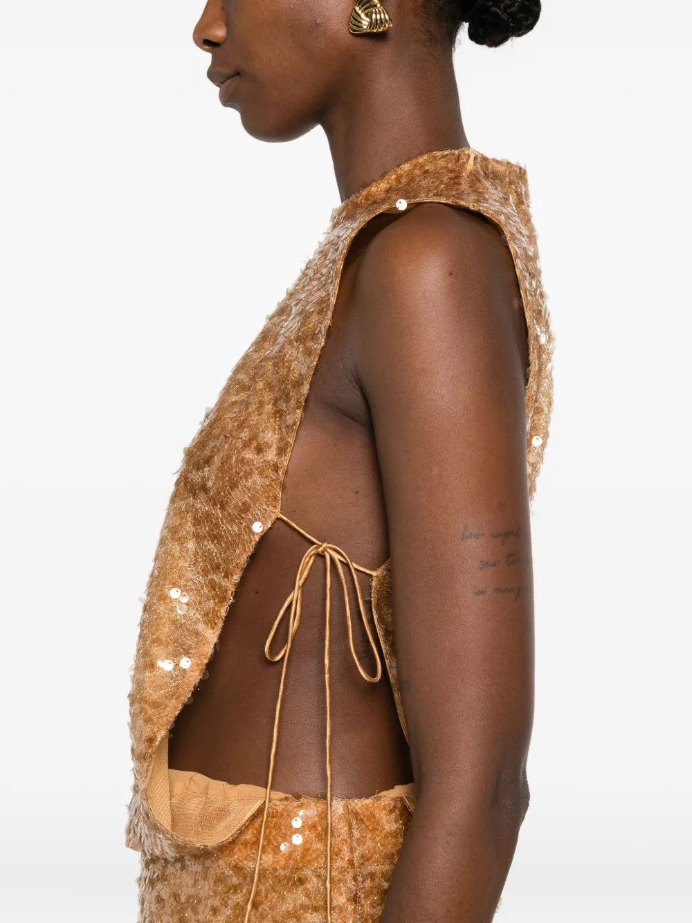 Radiate elegance in this stunning Christopher Esber Illuminate gown, where luxurious amber yellow sequins catch every light for an unforgettable entrance. The sleeveless silhouette with a refined round neckline offers timeless sophistication, while the side tie fastening provides a flattering, adjustable fit. Perfect for evening events, galas, or any occasion demanding show-stopping glamour, this sequin-embellished masterpiece transforms you into the center of attention with its radiant, eye-catching design