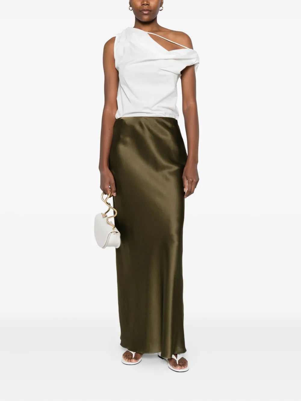 Elevate your wardrobe with the Chantel maxi skirt from Cult Gaia. Featuring a vibrant green hue and a sleek straight hem, this skirt offers a polished and modern silhouette. Its concealed zip fastening ensures a seamless look, while the high-shine finish adds a touch of sophistication for both day and evening wear. Perfect for making a statement with understated elegance.