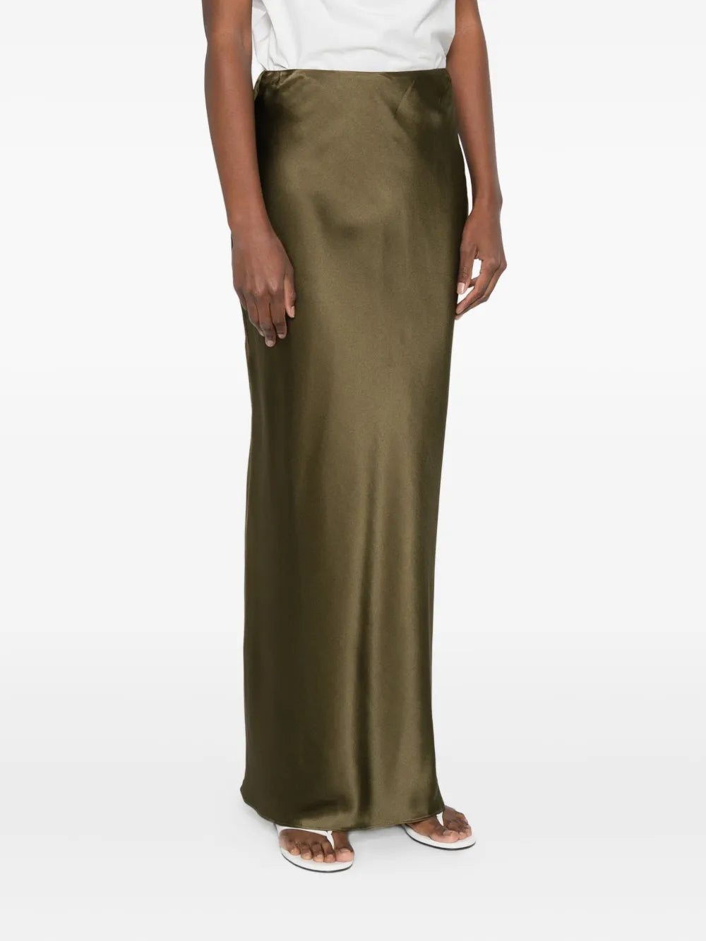 Elevate your wardrobe with the Chantel maxi skirt from Cult Gaia. Featuring a vibrant green hue and a sleek straight hem, this skirt offers a polished and modern silhouette. Its concealed zip fastening ensures a seamless look, while the high-shine finish adds a touch of sophistication for both day and evening wear. Perfect for making a statement with understated elegance.
