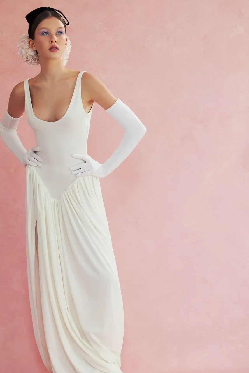 Elevate your style with the Cleopatra Maxi Dress. Accentuated thigh line and bodysuit-inspired shape create a flattering silhouette while the slit adds a touch of sultry charm. Embrace your inner queen and make a statement in this must-have piece!