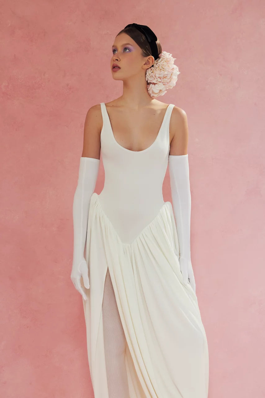 Elevate your style with the Cleopatra Maxi Dress. Accentuated thigh line and bodysuit-inspired shape create a flattering silhouette while the slit adds a touch of sultry charm. Embrace your inner queen and make a statement in this must-have piece!