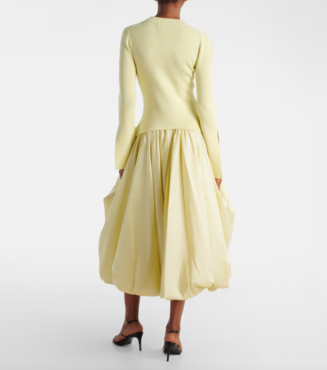 The Izzy Taffeta Midi Dress from Simkhai offers a striking blend of textures, featuring a ribbed-knit bodice that flatters your shape and a voluminous taffeta skirt that commands attention. This unique silhouette ensures you stand out effortlessly at any event, combining comfort with bold elegance for a memorable style statement.