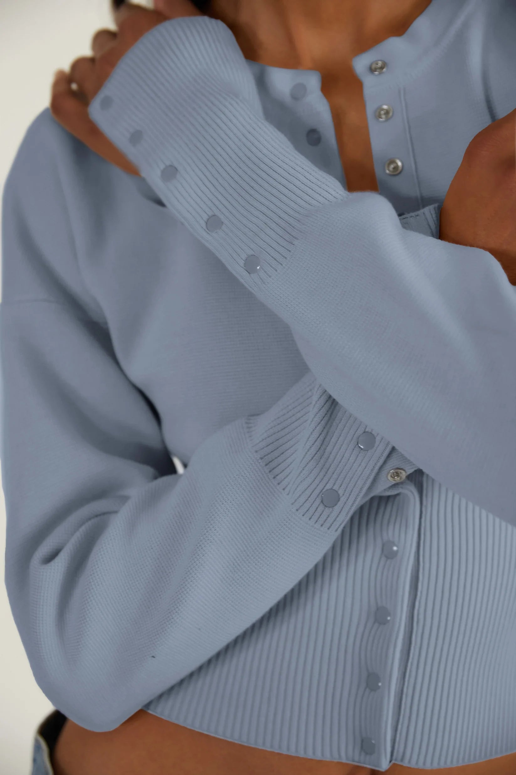 Elevate your style with The Weekend Knit Cardigan by Orseund Iris. Made from a luxurious blend of cotton and silk, this chunky Milano knit cardigan adds volume at the shoulders and cinches at the waist for a flattering silhouette. With its long and dramatic sleeves, it's the perfect addition to your wardrobe for a touch of sophisticated elegance.